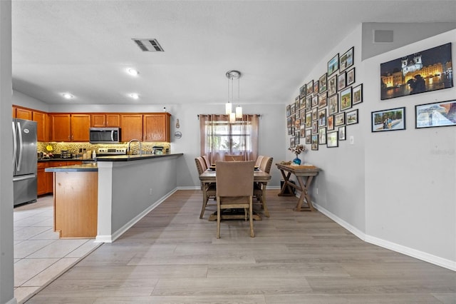 14566 Quail Trail Cir, Orlando, FL 32837 - dining area with light wood-style flooring and recessed lighting