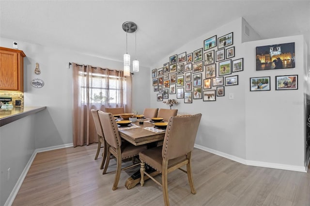 14566 Quail Trail Cir, Orlando, FL 32837 - dining space featuring light wood-style floors and baseboards