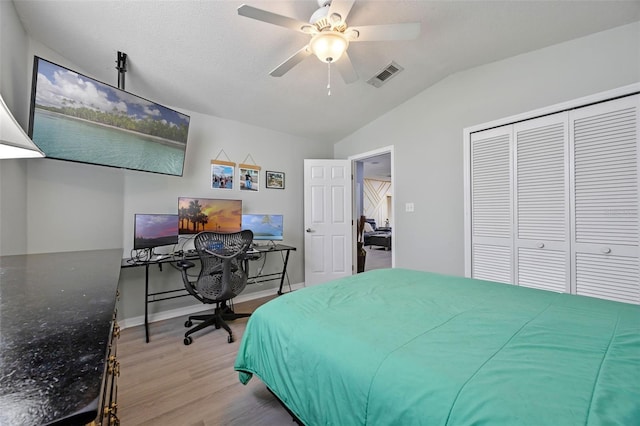 14566 Quail Trail Cir, Orlando, FL 32837 - bedroom featuring lofted ceiling, wood finished floors, a closet, ceiling fan, and a desk