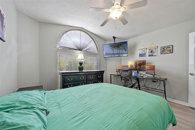 14566 Quail Trail Cir, Orlando, FL 32837 - bedroom with wood finished floors, lofted ceiling, a textured ceiling, and a ceiling fan