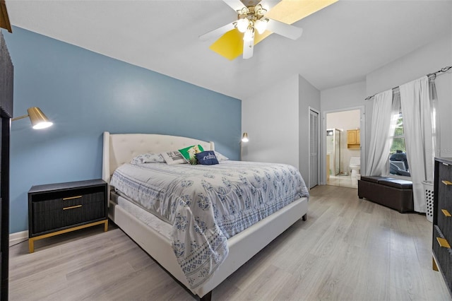 14566 Quail Trail Cir, Orlando, FL 32837 - bedroom featuring wood finished floors, a ceiling fan, and ensuite bathroom
