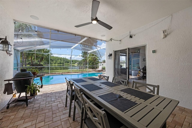 14566 Quail Trail Cir, Orlando, FL 32837 - view of patio / terrace featuring a ceiling fan, a lanai, outdoor dining area, and area for grilling