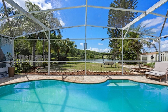 14566 Quail Trail Cir, Orlando, FL 32837 - view of swimming pool featuring a water view, glass enclosure, and a patio area