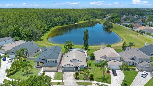 14566 Quail Trail Cir, Orlando, FL 32837 - aerial perspective of suburban area with a heavily wooded area and a nearby body of water