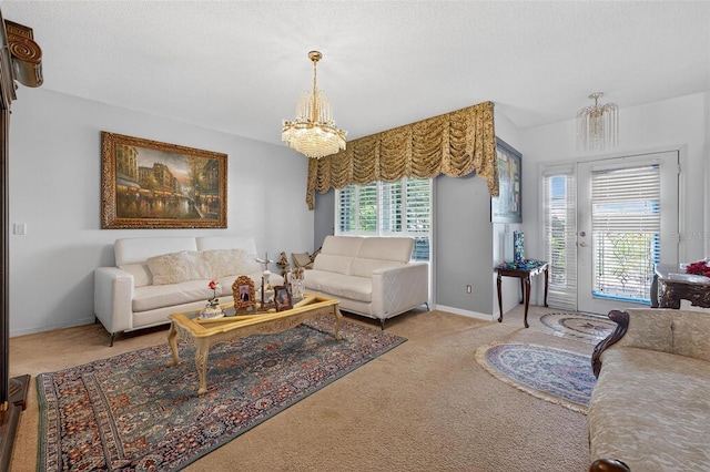 2076 Shannon Lakes Blvd, Kissimmee, FL 34743 - carpeted living room featuring a chandelier and baseboards