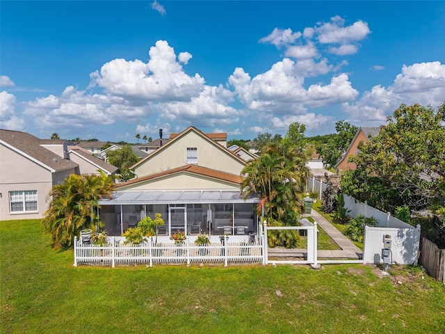2076 Shannon Lakes Blvd, Kissimmee, FL 34743 - rear view of house with a sunroom