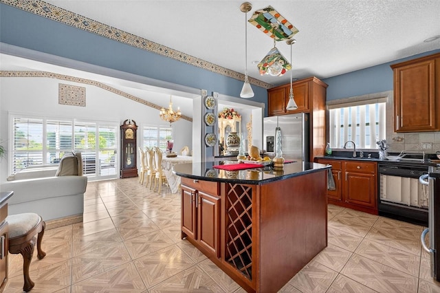 2076 Shannon Lakes Blvd, Kissimmee, FL 34743 - kitchen featuring stainless steel fridge with ice dispenser, dishwasher, a chandelier, dark countertops, and a kitchen island
