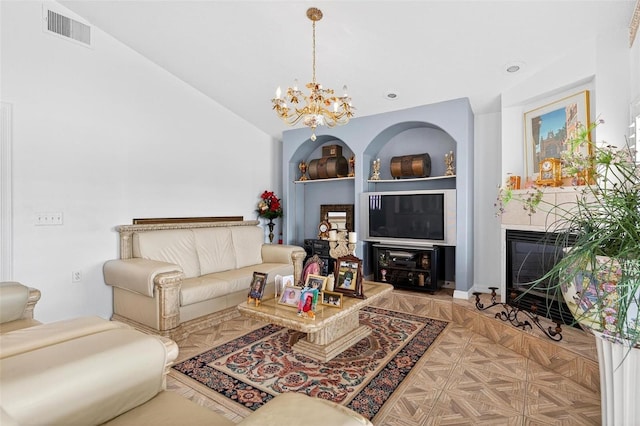 2076 Shannon Lakes Blvd, Kissimmee, FL 34743 - living area with a chandelier, vaulted ceiling, and a glass covered fireplace