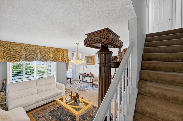2076 Shannon Lakes Blvd, Kissimmee, FL 34743 - living area with a chandelier, a textured ceiling, stairs, and carpet flooring