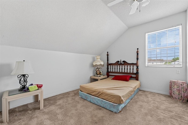 2076 Shannon Lakes Blvd, Kissimmee, FL 34743 - carpeted bedroom featuring a textured ceiling, vaulted ceiling, and a ceiling fan