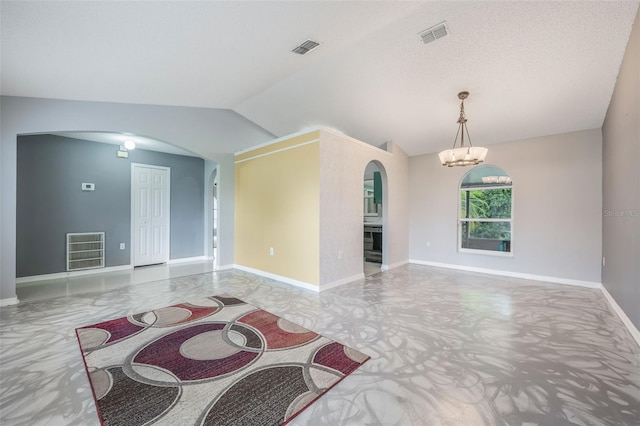 10675 Fairhaven Way, Orlando, FL 32825 - unfurnished living room featuring arched walkways, vaulted ceiling, and a chandelier