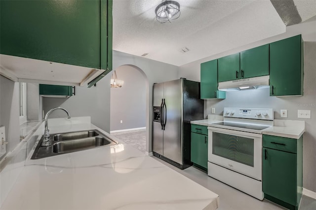 10675 Fairhaven Way, Orlando, FL 32825 - kitchen featuring under cabinet range hood, white electric stove, stainless steel refrigerator with ice dispenser, green cabinets, and light countertops