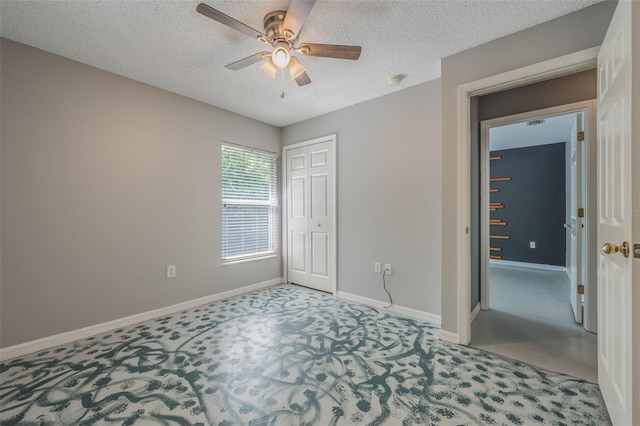 10675 Fairhaven Way, Orlando, FL 32825 - unfurnished bedroom with carpet floors, a closet, a textured ceiling, and a ceiling fan