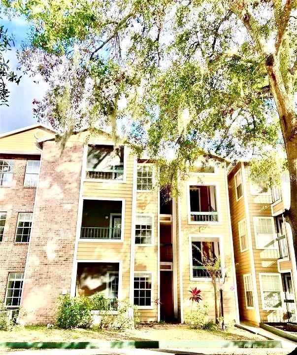5500 Devonbriar Way Unit 202, Orlando, FL 32822 - view of apartment building / complex