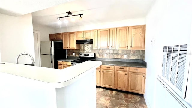 5500 Devonbriar Way Unit 202, Orlando, FL 32822 - kitchen with electric stove, under cabinet range hood, freestanding refrigerator, and decorative backsplash