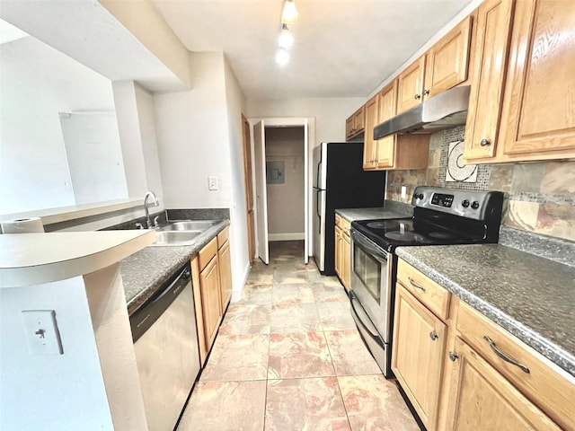 5500 Devonbriar Way Unit 202, Orlando, FL 32822 - kitchen featuring appliances with stainless steel finishes, under cabinet range hood, tasteful backsplash, a peninsula, and light brown cabinetry