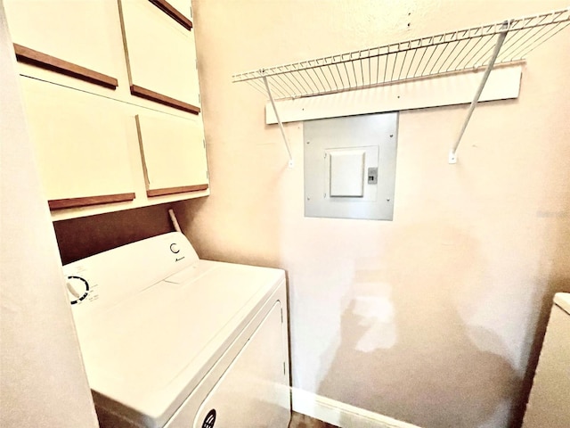 5500 Devonbriar Way Unit 202, Orlando, FL 32822 - washroom featuring washer / clothes dryer, electric panel, and cabinet space
