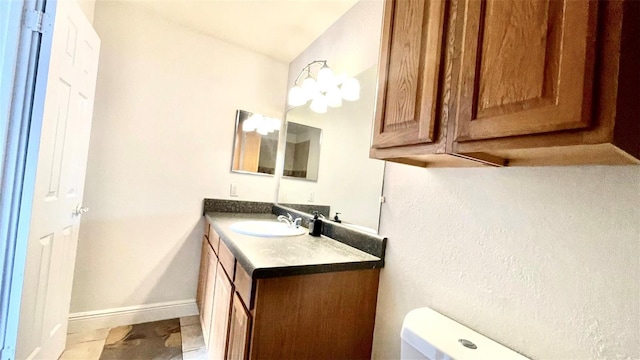 5500 Devonbriar Way Unit 202, Orlando, FL 32822 - bathroom featuring vanity and toilet