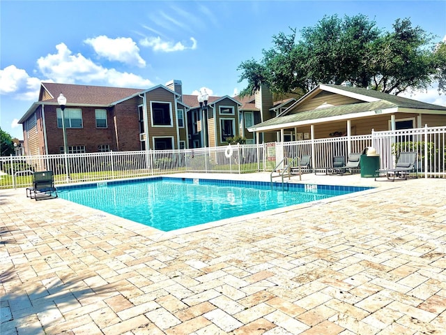 5500 Devonbriar Way Unit 202, Orlando, FL 32822 - community pool featuring a patio area