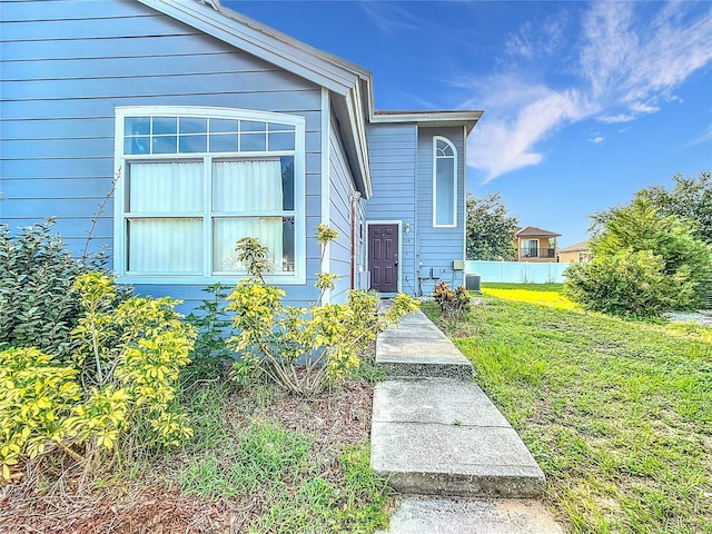 709 Orchid Dr, Davenport, FL 33897 - entrance to property featuring a lawn