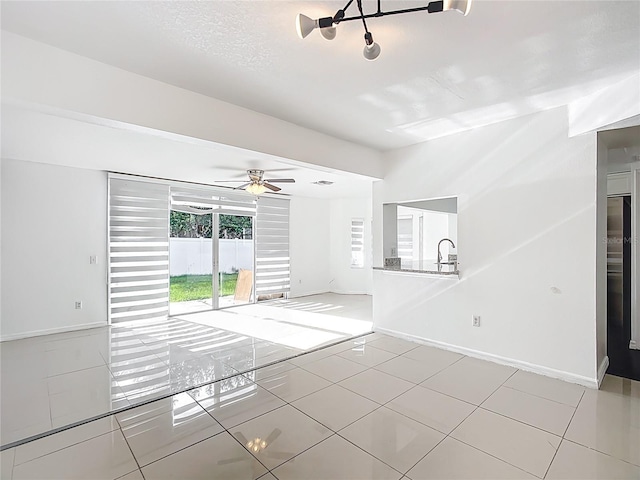 709 Orchid Dr, Davenport, FL 33897 - empty room with light tile patterned floors and ceiling fan
