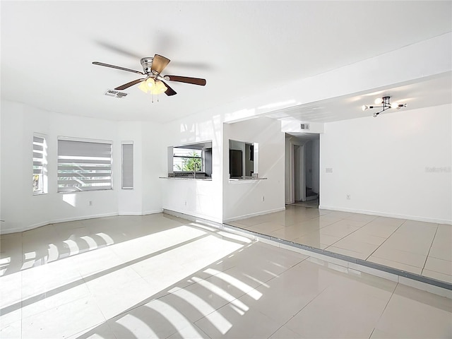 709 Orchid Dr, Davenport, FL 33897 - empty room with ceiling fan and light tile patterned flooring