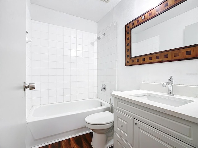 709 Orchid Dr, Davenport, FL 33897 - bathroom featuring vanity, wood finished floors, and shower / bath combination