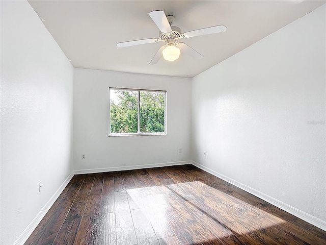 709 Orchid Dr, Davenport, FL 33897 - spare room featuring dark wood-style flooring and a ceiling fan