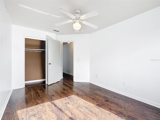 709 Orchid Dr, Davenport, FL 33897 - unfurnished bedroom with hardwood / wood-style floors, a closet, and a ceiling fan