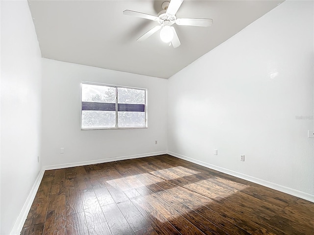 709 Orchid Dr, Davenport, FL 33897 - unfurnished room with dark wood-style floors, lofted ceiling, and ceiling fan