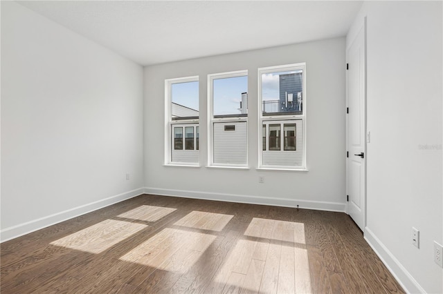 2018 Packing District Way, Orlando, FL 32804 - empty room with dark wood-type flooring and baseboards