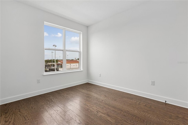 2018 Packing District Way, Orlando, FL 32804 - empty room featuring dark wood-style floors and baseboards