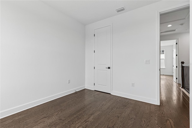 2018 Packing District Way, Orlando, FL 32804 - unfurnished bedroom with dark wood finished floors and recessed lighting