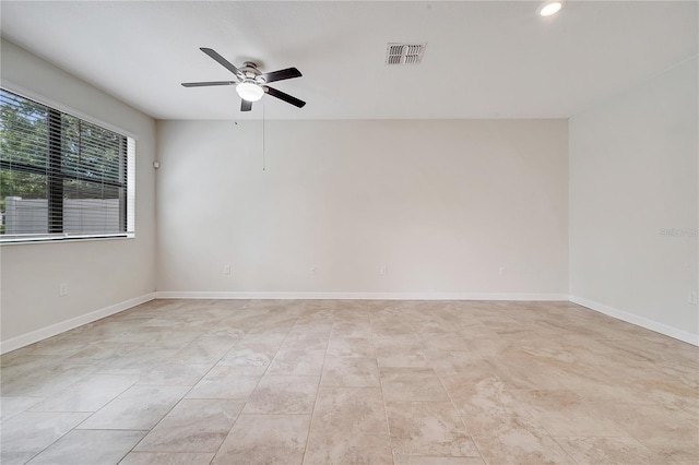 1246 Payne Stewart Dr, Davenport, FL 33896 - empty room featuring a ceiling fan and recessed lighting