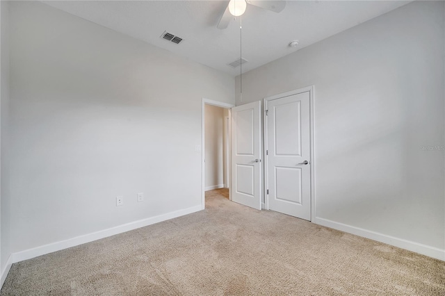 1246 Payne Stewart Dr, Davenport, FL 33896 - unfurnished bedroom featuring carpet flooring and a ceiling fan