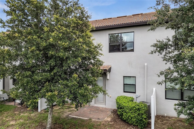 1246 Payne Stewart Dr, Davenport, FL 33896 - view of front of home with stucco siding and a tile roof