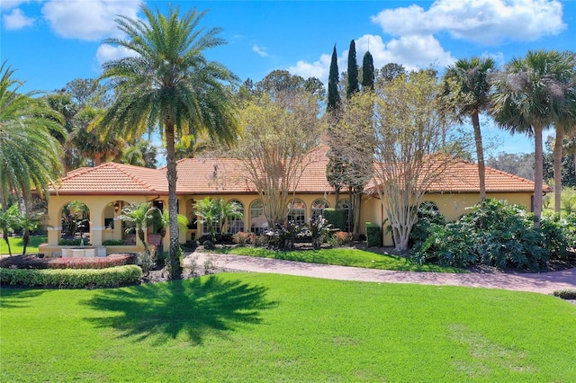 3130 Butler Bay Dr N, Windermere, FL 34786 - view of front of home with a tile roof, stucco siding, and a front yard