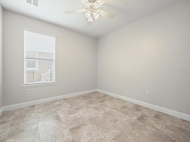 1709 Benoit Ter, Davenport, FL 33837 - spare room featuring baseboards and a ceiling fan