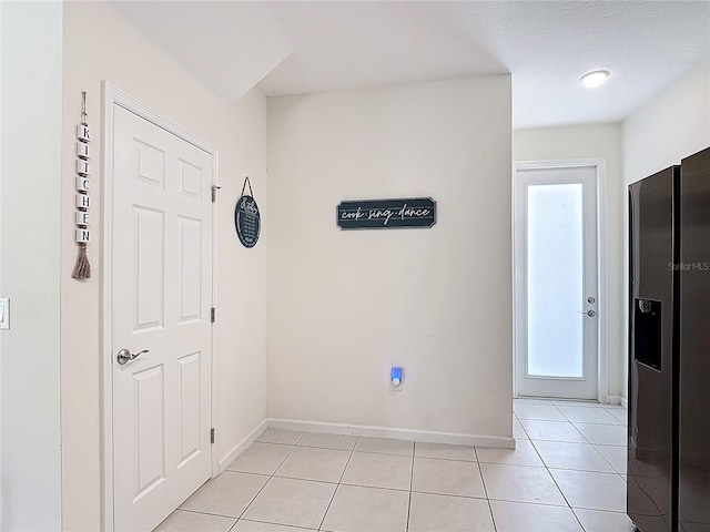 129 Boydfield Ln, Davenport, FL 33837 - foyer entrance featuring healthy amount of natural light and light tile patterned floors