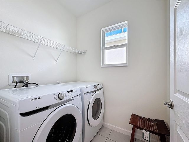 129 Boydfield Ln, Davenport, FL 33837 - washroom featuring washing machine and clothes dryer and light tile patterned floors