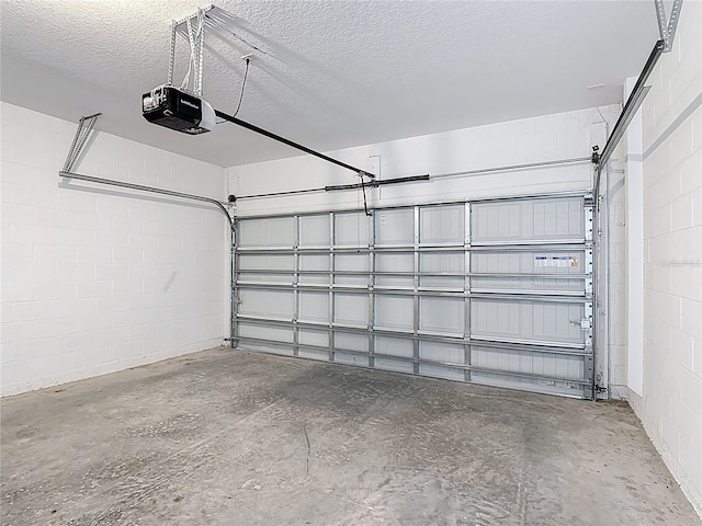 129 Boydfield Ln, Davenport, FL 33837 - garage featuring a garage door opener and concrete block wall