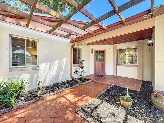 8346 Mattituck Cir, Orlando, FL 32829 - entrance to property with stucco siding and a pergola