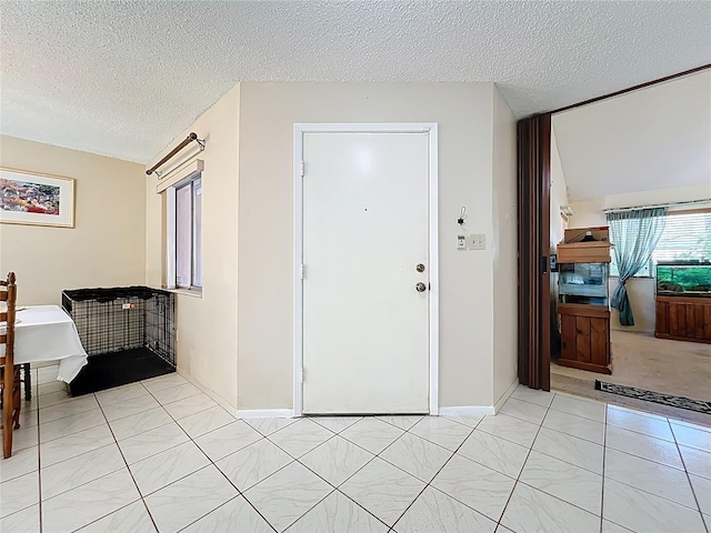 8346 Mattituck Cir, Orlando, FL 32829 - foyer with a textured ceiling and light tile patterned flooring