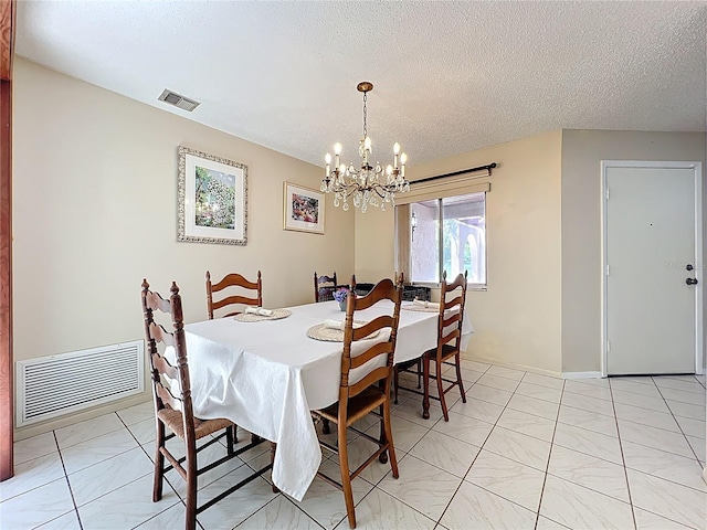 8346 Mattituck Cir, Orlando, FL 32829 - dining room with a chandelier and a textured ceiling