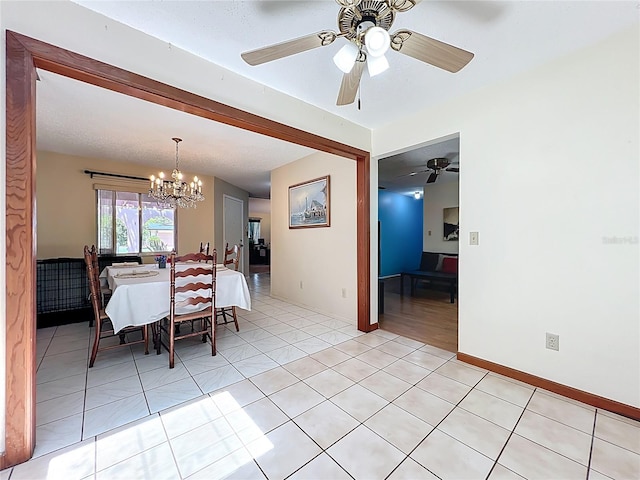 8346 Mattituck Cir, Orlando, FL 32829 - dining room featuring a chandelier, ceiling fan, and light tile patterned floors