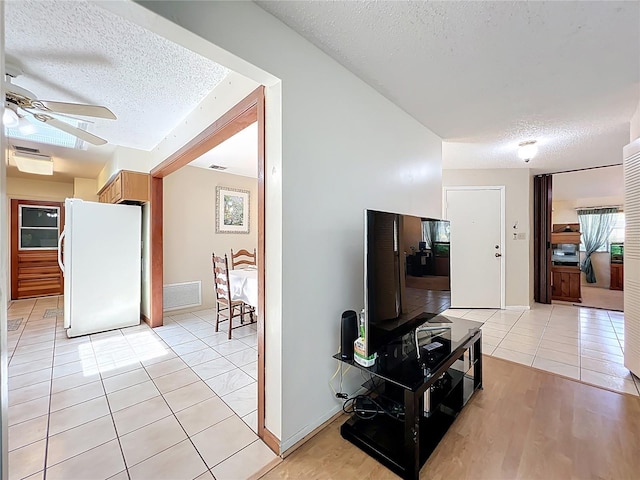 8346 Mattituck Cir, Orlando, FL 32829 - hall featuring a textured ceiling and light tile patterned floors