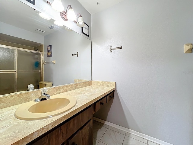 8346 Mattituck Cir, Orlando, FL 32829 - full bathroom featuring vanity, a stall shower, and marble finish floors