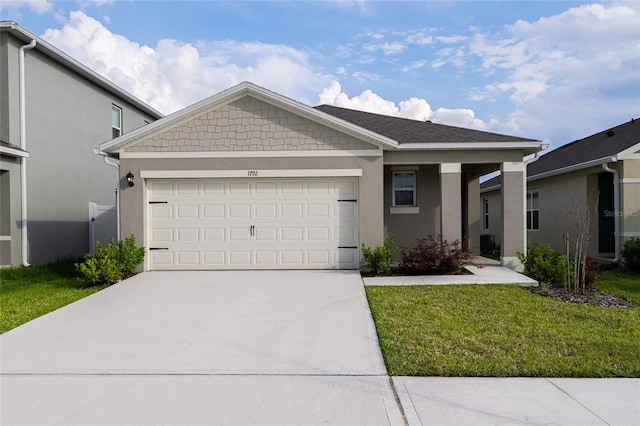 1792 Bull Hill Rd, Kissimmee, FL 34744 - view of front of house featuring stucco siding, driveway, a garage, and a front lawn