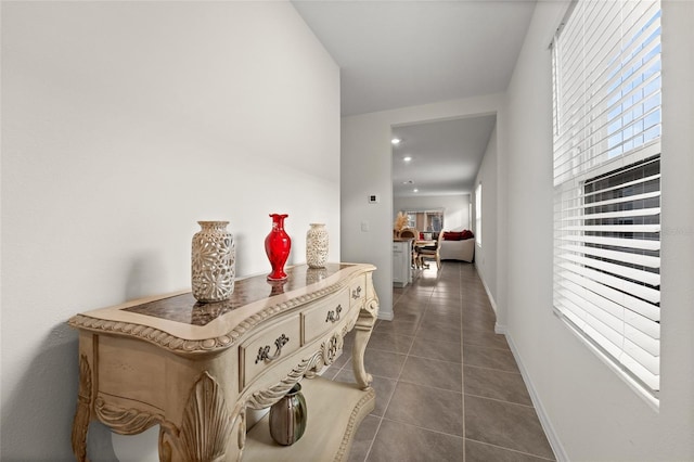 1792 Bull Hill Rd, Kissimmee, FL 34744 - corridor featuring dark tile patterned flooring and baseboards