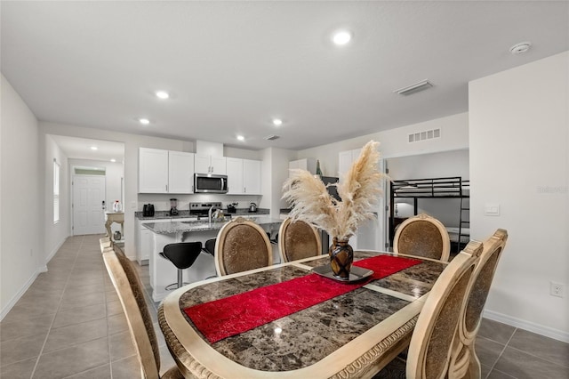 1792 Bull Hill Rd, Kissimmee, FL 34744 - dining area featuring light tile patterned flooring and recessed lighting